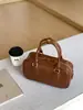 Bolsa Boston de PU estilo coreano para bolos, bolso de mano pequeño de nicho para el otoño y el invierno, bolso de hombro y bandolera versátil y moderno para mujer