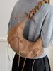 Bolsa de meia-lua plissada de grande capacidade para mulheres, nova moda 2026 bolsa de ombro de camurça com laço, bolsa transversal para o dia a dia