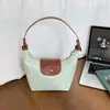Bolsa de cubo tote de estilo coreano de nicho al por mayor para mujer, nueva colección otoño 2026, bandolera de retazos en bloques de color, bolsa de hombro para el trabajo