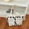 Bolsa de mano de gran capacidad, nuevo estilo para mujer, estampado en lienzo de alta gama, moderna y casual, irradia un ambiente chic y relajado
