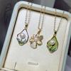 Nuevo collar de perlas con incrustaciones de agua dulce con flores de palacio retro chino, colgante de temperamento esmaltado con gotas, venta al por mayor para mujeres