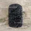 Ventas Directas de Fábrica Xinjiang natural Lantian Moyu Colgante de pared Jiulong tallado a doble cara Piedra del Rey de la Medicina Meteorito de oliva al por mayor