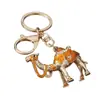 Regalos de Xinjiang al por mayor: Llaveros creativos de camello, llaveros para coche, colgantes decorativos, exquisitos accesorios para bolso con temática de animales para mujer