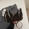 Bolso de Alto Valor Estilo Coreano Otoño 2026 Nuevo Lanzamiento Bolso de Cadena de Nicho Bolso Baguette para Debajo del Brazo Bolso de Hombro Sencillo y Elegante Bolso Cruzado