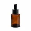 Em estoque na fábrica 20ml30ml60ml frasco conta-gotas cilíndrico de ombro plano preto frasco de óleo com tampa de pressão giratória de vidro