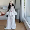 Conjunto Casual Chic de Verão 2025 para Meninas Novo Top sem Mangas de Renda com Folha de Lótus Vazada Calça Reta de Perna Larga