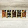 Fabricante mayorista de encendedores, encendedor publicitario de barra de oro electrochapado con impresión de colores creativos, carcasa de metal de hierro recargable con rueda de pedernal