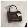 Bolso pequeño vintage de alta calidad para mujer, nuevo bolso cruzado de moda versátil 2026, bolso tipo cubo de mano súper popular