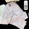 Pijama de casa para niñas de jacquard de seda de hielo suave, conjunto de dos piezas de manga larga, cómodo y simple, adecuado para el hogar y se puede usar afuera