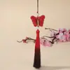 Bordado de mariposa en degradado dorado estilo nacional falda antigua con cara de caballo accesorios colgantes borla de púas hecha a mano joyería al por mayor