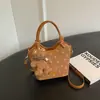 Bolsa de Ombro Nova de Bolinhas Outono/Inverno 2026 Bolsa Balde Simples para o Dia a Dia Bolsa para o Trabalho Bolsa de Mão Versátil Casual Bolsa de Ombro