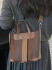 Shuai Mi Jia bolsa de mano de gran capacidad 2026 nuevo color de moda a rayas de bloques de color para el día a día bolso de hombro artístico estilo francés