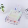 Suministro directo de fábrica bolsa de compras tote mágica de color láser transparente bolsa de compras tote mágica de color pvc bolsa de pvc bolsa de pedido