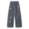 Pantalones cargo casuales de algodón puro con bordado floral tridimensional estilo vintage y múltiples bolsillos