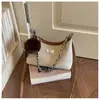 Bolso de axila de moda para mujer 2026 Nuevo modelo de gama alta versátil para el trabajo diario bolso de hombro bolso cruzado casual simple con cadena