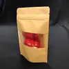 Bolsa con cierre de papel Kraft auto-soportable auto-sellante ventana translúcida snacks fruta deshidratada té aceite para alimentos bolsa de embalaje a prueba de sellado bolsa sellada