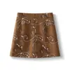 Falda de gamuza bordada jacquard vintage para mujer, otoño, cintura alta, aspecto adelgazante, minifalda Maillard, línea A ajustada a la cadera