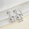 Pendientes europeos y americanos de diseño floral con forma de corazón transfronterizos, pendientes de diseño de nicho de lujo ligero, accesorios para la oreja de moda y versátiles