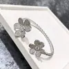 Pulsera de Borde de Perlas de Diamante Incrustado con Doble Flor de Venta Caliente Transfronteriza Europea y Americana Trébol Flor de Seis Pétalos Apertura Pulsera de Nicho Pulsera