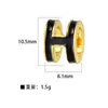 Accesorios para joyería diy directos de fábrica colgante H chapado en cobre colgante simple de piedra ojo de gato colgante de cisne microincrustado sin cadena