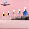 Botella redonda de hombro de 30 ml para aceites esenciales, en stock; botella dispensadora con gotero para pasteles de 20 ml; botella de vidrio transparente de 15 ml para productos de cuidado de la piel