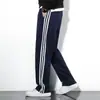 Pantalones casuales de uniforme escolar para primavera y otoño, azul marino con una sola raya, corte holgado, estilo de pierna recta, adecuados para estudiantes de secundaria y preparatoria, tanto para niños como para niñas