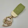 Patrón de cocodrilo Llavero francés mini cadena corta para llave de coche colgante de alta gama llavero decorativo de moda regalo