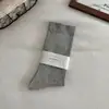Calcetines sin costuras para mujer, engrosados y de caña alta para primavera y otoño, calcetines holgados para maternidad, calcetines holgados de color liso versátiles estilo japonés, calcetines largos Maillard