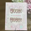 Un par de puntas de uñas hechas a mano delicadas, con forma de corazón, de lunares rosas, con lazo de mariposa, estilo ojo de gato