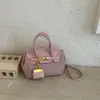 Bolso platino de gran capacidad estilo coreano de nicho para mujer, nuevo modelo 2026, bolso Kelly con estampado de lichi, diseño simple, bolso de mano de color sólido