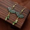 Nuevos pendientes de borla de abanico chino pendientes de bambú verde antiguo joyería para orejas de cheongsam para mujer ropa Han falda de caballo suministro al por mayor