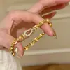 Pulsera Retro Francesa con Hebilla de Herradura Ojo de Gato Incrustada de Diamantes para Mujer, Pulsera de Cuerda Elástica de Nicho de Alto Gama Estilo Antiguo
