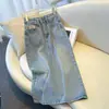 Saia jeans de cor clara feminina primavera e verão 2024 Nova saia de quadril de cintura alta de comprimento médio emagrecimento dividido em linha A