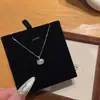 Colar de gatinho fofo com pingente de laço esmaltado cravejado de diamantes, uma corrente de clavícula doce e feminina, atacado