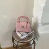 Bolso de mano de moda con cierre de hebilla de patrón de diamante para mujer, nuevo modelo 2026 bolso de hombro con cadena, bolso cruzado simple y elegante de nicho
