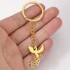Yiwu pequeña fábrica de joyería directa moda simple acero titanio corte hueco colgante Fénix llavero acero inoxidable