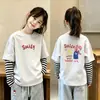 Nueva camiseta de estilo coreano para niñas, imitación de dos piezas, manga larga, camiseta básica de algodón puro para otoño, top versátil y elegante a la moda para niñas