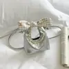 Bolsa pequena doce e fofa para mulheres, nova versão coreana, bolsa de mão versátil para batom e moedas, bolsa de ombro e transversal de nicho, transfronteiriça