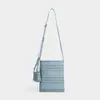 Bolso tejido a mano nuevo de nicho con diseño calado y sensación de alta gama, bolso de paja estilo vacacional, bolso de playa, bolso bandolera tipo cubo