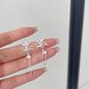 Pendientes largos con borlas y lazo de circonitas de amor, estilo hada simple, delicados y con diseño de nicho, 2024