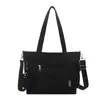 Bolsa de lona simples para mulheres, novo modelo 2026, grande capacidade, bolsa tote versátil, adequada para estudantes universitários indo para a aula, bolsa transversal