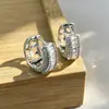 Pendientes de superventas transfronterizos europeos y americanos, cierres de oreja de circonita de cobre, totalmente incrustados de diamantes, adecuados para ir al trabajo, con un toque de lujo ligero y de alta gama, pendientes para mujer