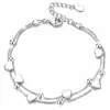 Pulsera en capas de cadena de clip con colgante de cruz minimalista transfronteriza europea y americana, una pulsera de estilo de lujo moderno y discreto para mujer