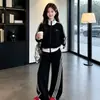 Conjunto de otoño para niñas 2026 nuevo estilo infantil moderno ropa deportiva de principios de otoño para niñas mayores conjunto de dos piezas primavera y otoño