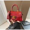 Bolso de mano de moda transfronteriza para mujer, nuevo bolso cruzado de diseño simple en color liso de invierno 2024, bolso de hombro retro texturizado.