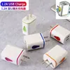 Cargador de teléfono móvil con luz LED de color USB dual multicolor calibre europeo calibre estadounidense cargador de gota de agua venta al por mayor transfronteriza