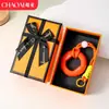 Chaveiro de anel de aperto criativo transfronteiriço para alívio de estresse, mini treinador de dedos colorido, dispositivo de aperto para alívio de estresse, pingente de mochila