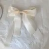 Clip de resorte con lazo de perla, accesorio para el cabello de alta gama, elegante y francés para celebridades de Internet.