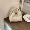 Moda de bolsos de mano de diseño nicho, estilo casual para el día a día, transfronterizo 2026, bolso tipo empanada para mujer, bolso de mano para el trabajo