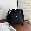 Bolso pequeño de lona estilo coreano para mujer, nuevo bolso tipo cubo con cordón de color liso, moda 2026, bolso cruzado moderno para el día a día